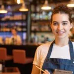 smiling woman wearing apron